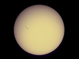 Looking at the Sun. Two large sunspots and two smaller ones